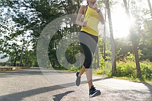 à¹à¹Young fitness sports woman runner running on tropical park trail, Young fitness woman running at morning tropical forest